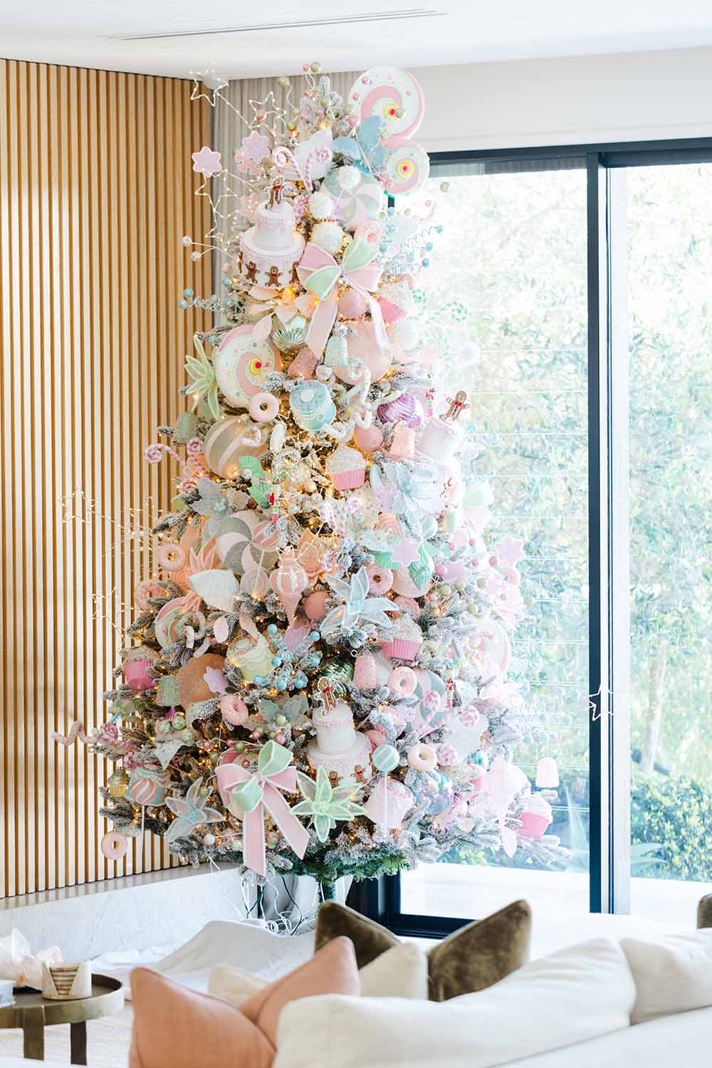 Large unique Christmas tree with pastel decorations, beautiful christmas trees and luxury christmas tree design for decorating your home for christmas.