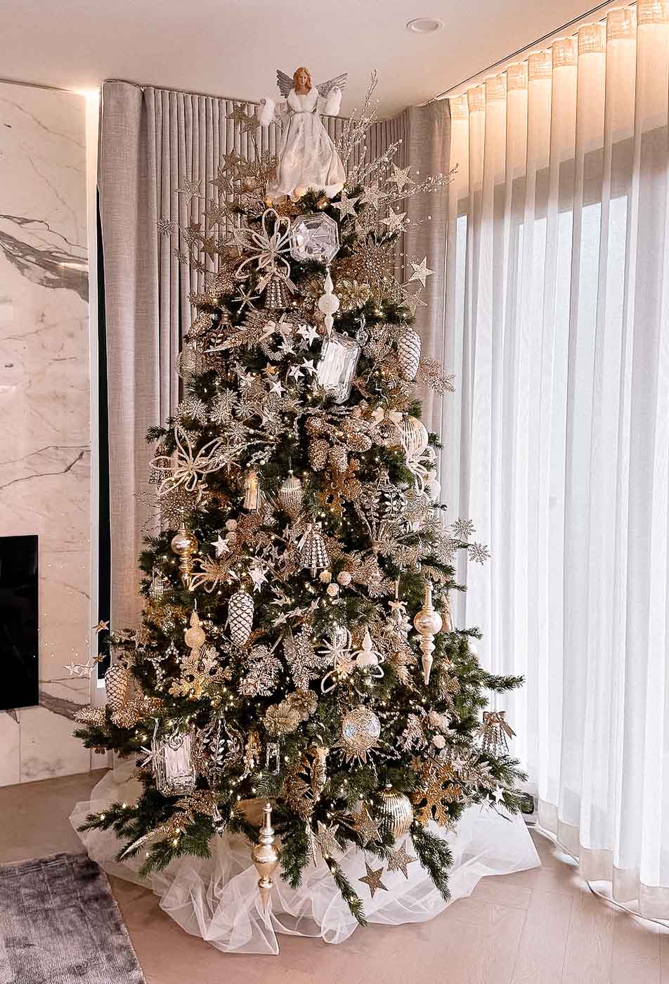 Elegant Christmas tree with gold and silver ornaments, designed by Dancer and Dasher, interior decorators for Christmas Sydney