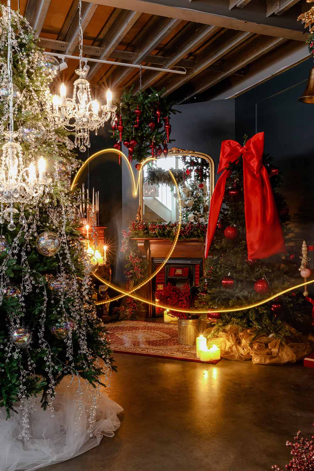 Opulent christmas store Sydney with luxury christmas decor, grand tree adorned with garlands, tree toppers, and glowing candles.