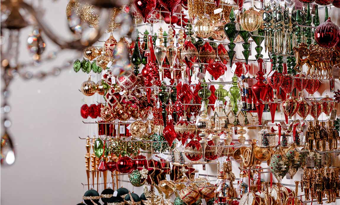 Lavish display of red, green, and gold Christmas ornaments, curated by Christmas Decorators Sydney and Dancer and Dasher.