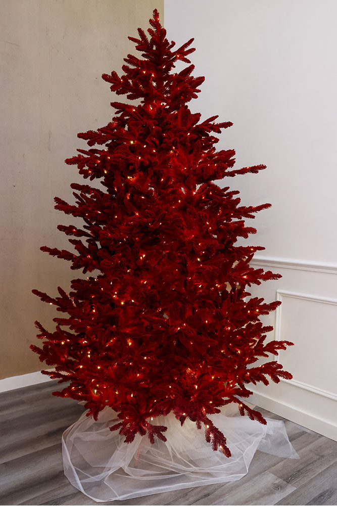 Ruby Red artificial Christmas tree with lights on a white background