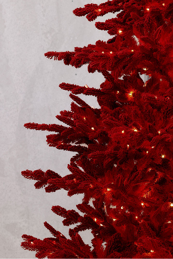 Ruby Red Christmas tree with lights on a white background