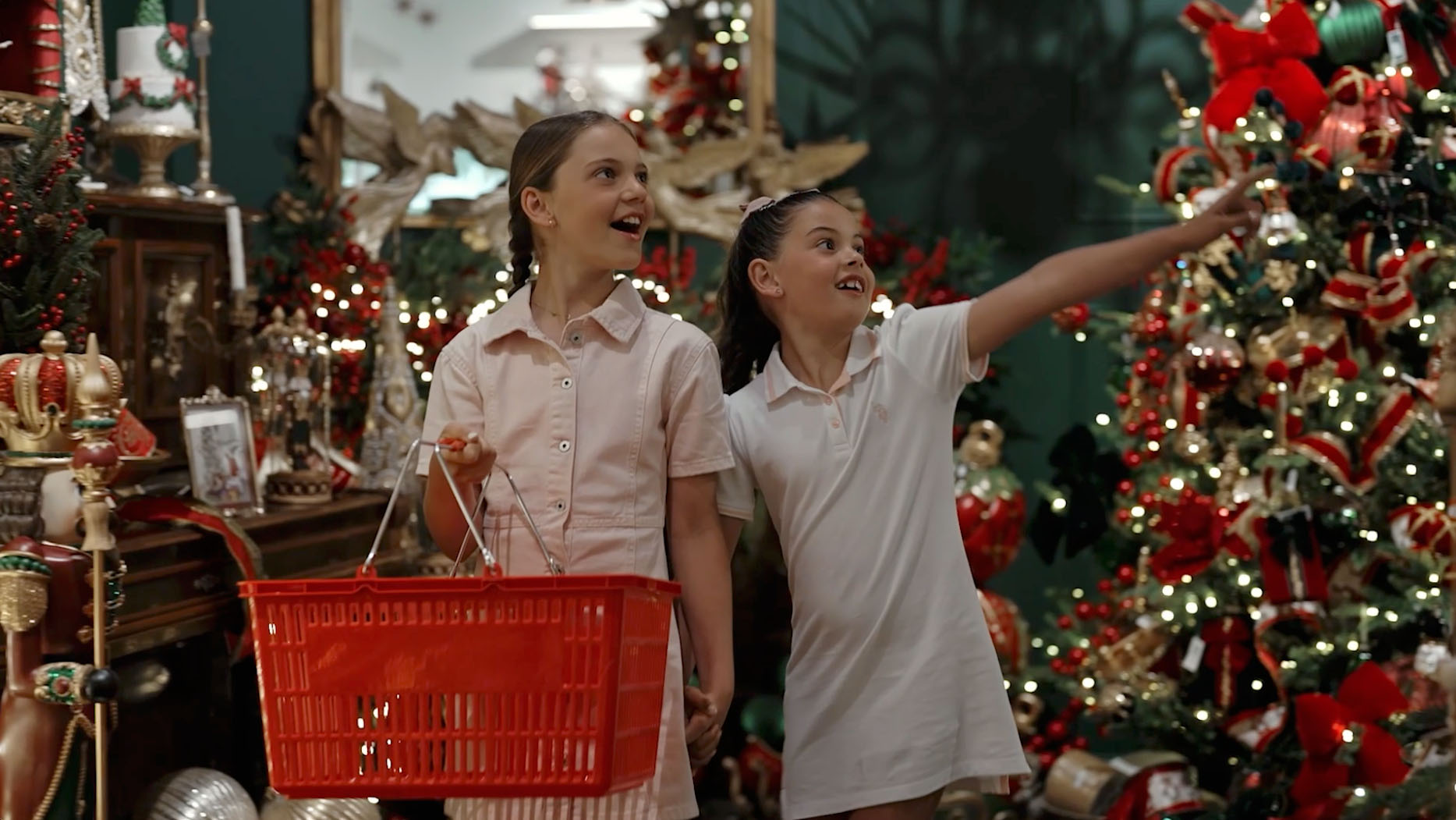 Two young girls shopping for luxury Christmas ornaments and decorations at Dancer & Dasher Christmas store Sydney